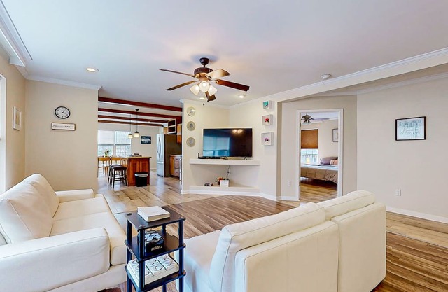 Sunny dog-friendly home with a pool, balcony, smart TVs, washer/dryer, & AC