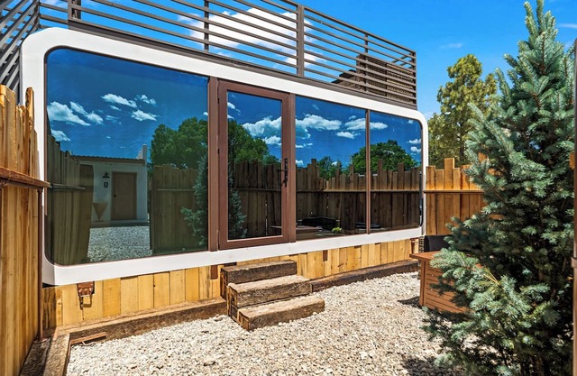 LUXX Space Cabin Tiny House with rooftop deck, private fenced patio.