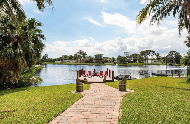 Waterfront Getaway! 3BR on Canal + Row Boat – Near Beach & Atlantic Ave Fun!