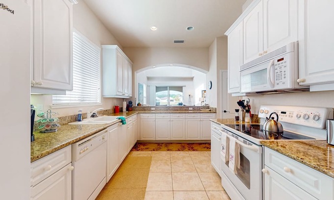 Halifax Casa | Corner-lot home with water view, on-site golf, enclosed patio, BBQ, & W/D