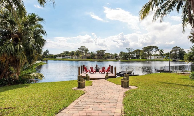 Tropic Palms Casa | Waterfront Getaway! 3BR on Canal + Row Boat – Near Beach & Atlantic Ave Fun!